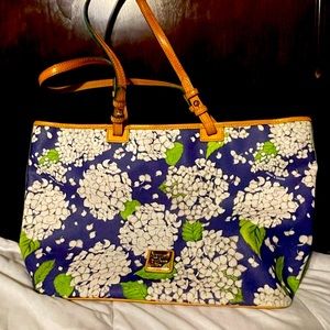 Gently used Dooney & Bourke floral print bag with red interior & leather straps